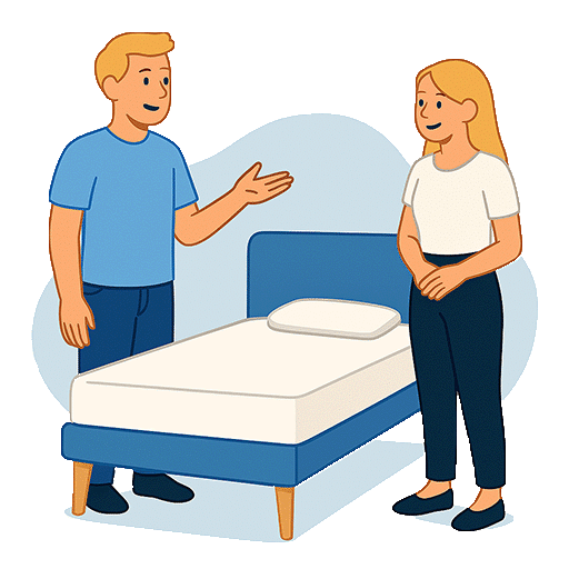 Zwei Personen beraten sich über ein Bett mit blauem Rahmen und einer Matratze ohne Bezug.