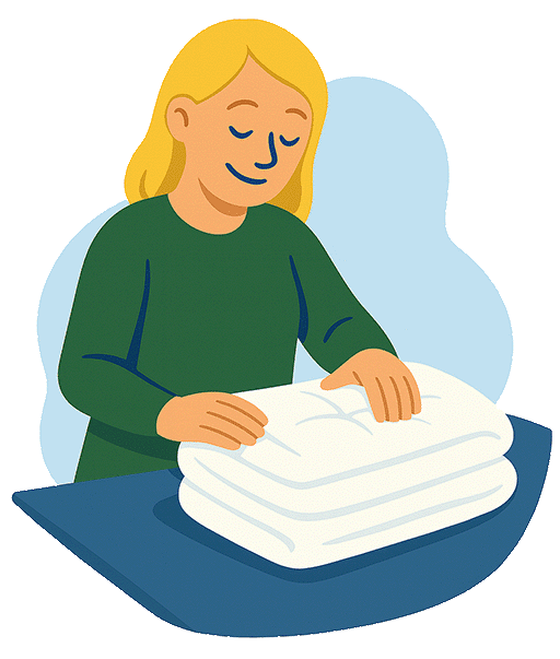 Frau legt frisch hergestellte, weiße Decke auf einen Tisch.